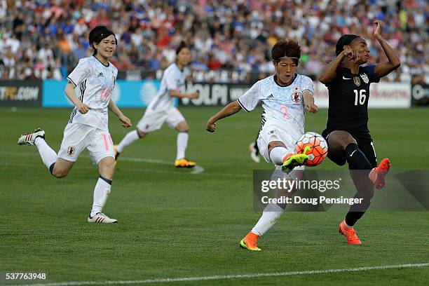 Saori Ariyoshi of Japan and Crystal Dunn of United States of America vie for control of the ball during an international friendly match at Dick's...