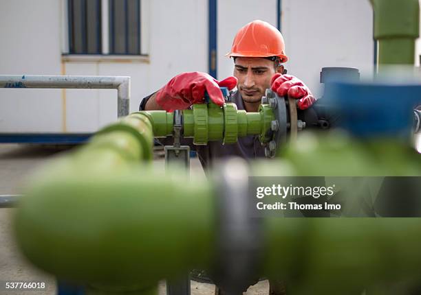 Amman, Jordan An employee of a decentralized sewage treatment plant in the Public Security Directorate adjusts a water pipe on April 06, 2016 in...