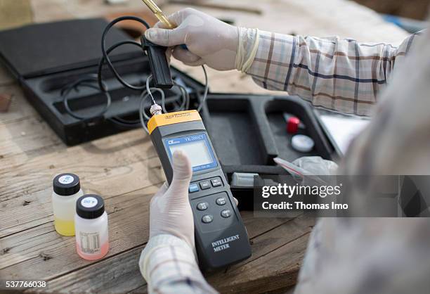 Amman, Jordan An employee of a decentralized sewage treatment plant in the Public Security Directorate is checking a water sample on April 06, 2016...