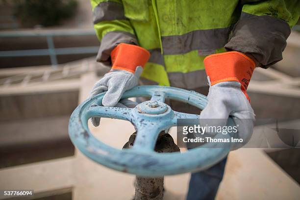 Fuheis, Jordan An employee of a sewage treatment plant uses a handwheel on April 06, 2016 in Fuheis, Jordan.
