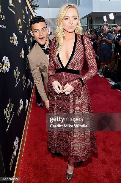 Rami Malek photobombs Portia Doubleday during the Television Academy's 70th Anniversary Gala on June 2, 2016 in Los Angeles, California.