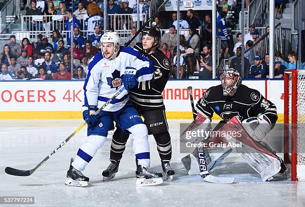 Zach Hyman of the Toronto Marlies battles for space with Aaron Ness and Justin Peters of the Hershey Bears during AHL Eastern Conference Final...