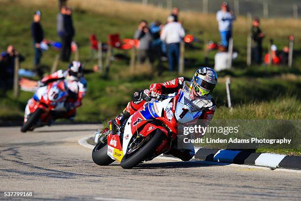 John McGuinness leads local Isle of Man rider Conor Cummins over the mountain during an evening practice at The Isle of Man TT Races on June 02, 2016...