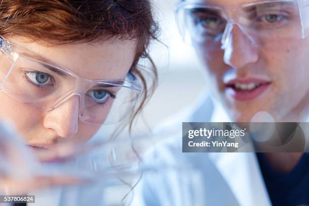 close-up of research scienctists chemists working in laboratory horizontal - laboratorium bildbanksfoton och bilder