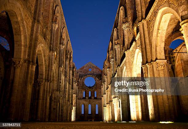 abbey of st. galgan (san galgano) at dusk - knights of the round table arthurian legend stock pictures, royalty-free photos & images