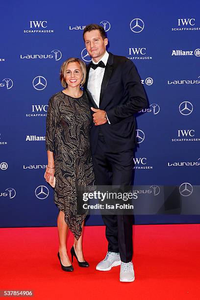 Ironman Jan Frodeno and his wife Emma Snowsill attend the Laureus World Sports Awards 2016 on April 18, 2016 in Berlin, Germany.