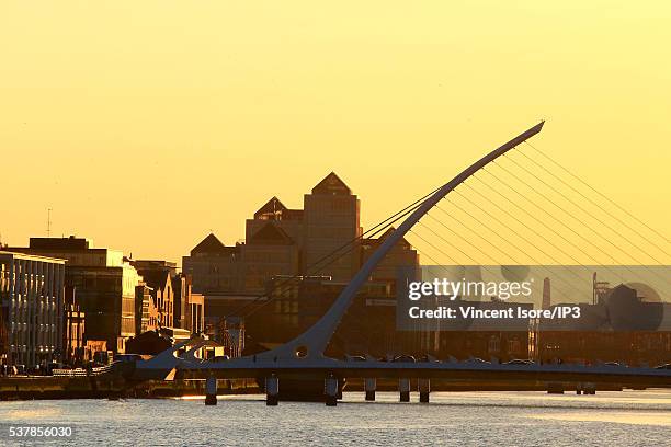The Liffey River Banks seen at sunset, with as foreground, the Samuel Beckett s Bridge on April 19, 2016 in Dublin, Ireland. Illustrative picture of...