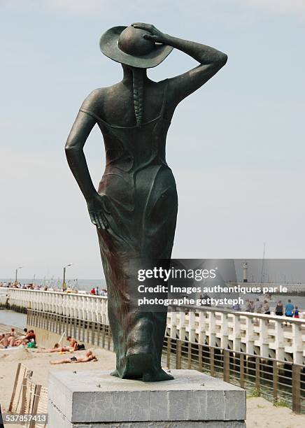 the women statue front the port entrance - bronze statue stock pictures, royalty-free photos & images