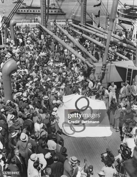The flag of the Olympiad is raised on the Manhattan over the largest U.S. Olympic squad ever to sail to present its case before the world's highest...