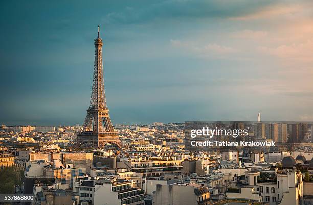 skyline of paris with eiffel tower during sunset (paris, france) - paris france stock pictures, royalty-free photos & images