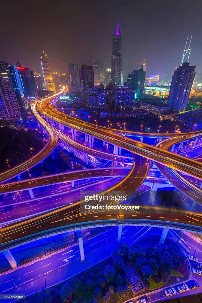 Futuristic highway neon skyscraper cityscape illuminated at night Shanghai China