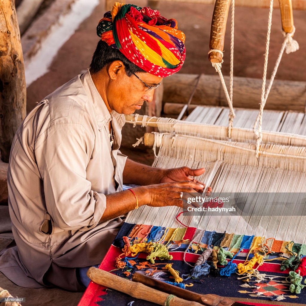 Indian man weaving textiles (durry) in Rajasthan