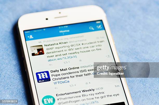 twitter feed on iphone 6 - terrorism news stock pictures, royalty-free photos & images