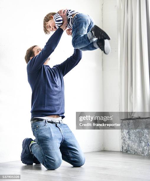 happiness young kid running to the father - carrying on shoulders stock pictures, royalty-free photos & images