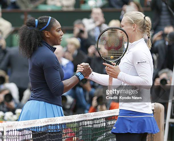 World No. 1 Serena Williams and Kiki Bertens of the Netherlands shake hands after their semifinal match of the French Open in Paris on June 3, 2016....