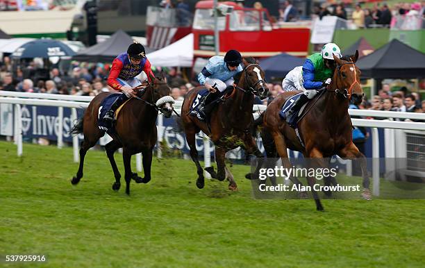 Jimmy Fortune riding Smuggler's Moon win The Invrstec Surrey Stakes at Epsom Racecourse on June 3, 2016 in Epsom, England.