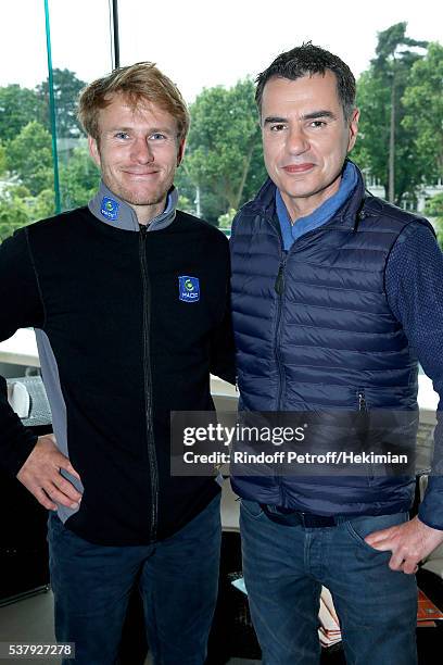 Navigator Francois Gabart and Sports Journalist Laurent Luyat pose at France Television french chanel studio during Day Thirteen of the 2016 French...