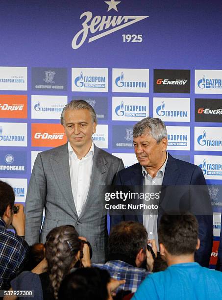 President of FC Zenit Saint Petersburg Alexander Dyukov and Mircea Lucescu pose for a photo during his first press conference as head coach of FC...