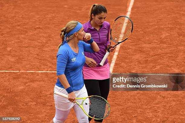 Margarita Gasparyan and Svetlana Kuznetsova of Russia talk tactics during the Ladies Doubles semi final match against Caroline Garcia and Kristina...