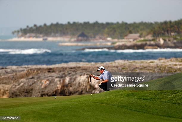 Andrew Svoboda of the United States lines up a putt on the 8th hole during the rain-delayed first round of the Corales Puntacana Resort And Club...