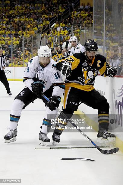 Sidney Crosby of the Pittsburgh Penguins in action against Nick Spaling of the San Jose Sharks in Game Two of the 2016 NHL Stanley Cup Final at...