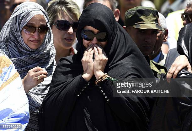 Mourners pray over the coffin of Mohamed Abdelaziz, the leader of the Western Sahara's Polisario Front, during his funeral in the Algerian city of...