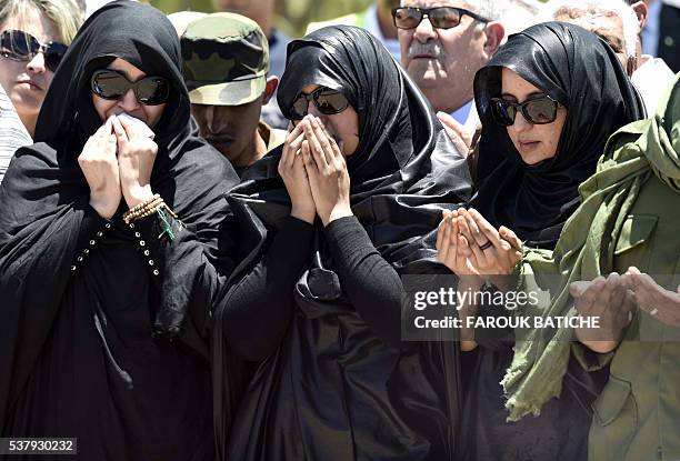 Mourners pray over the coffin of Mohamed Abdelaziz, the leader of the Western Sahara's Polisario Front, during his funeral in the Algerian city of...