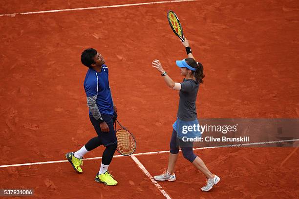 Martina Hingis of Switzerland and Leander Paes of India celebrate victory during the Mixed Doubles final match against Sania Mirza of India and Ivan...