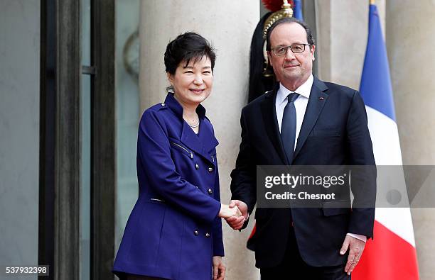 French President Francois Hollande welcomes South Korean President Park Geun-hye prior to a meeting at the Elysee Presidential Palace on June 3, 2016...