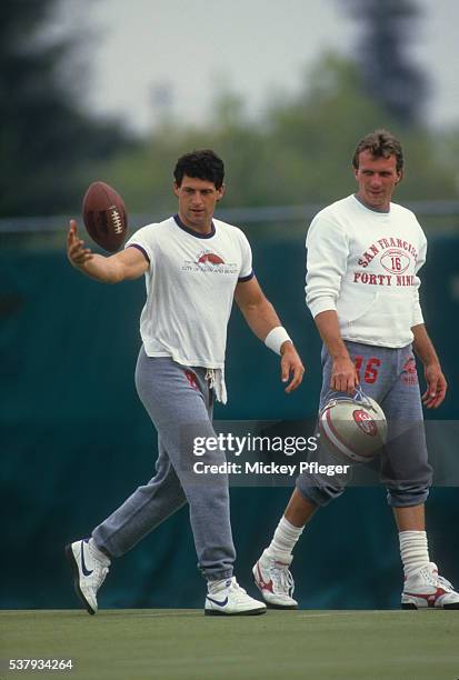 San Francisco 49ers QB Steve Young and QB Joe Montana casual during practice session at Red Morton Park. 49ers return to field after 24-day players'...