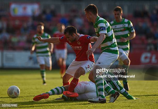 Dublin , Ireland - 3 June 2016; Christy Fagan of St Patricks Athletic is tackled by Stephen McPhail of Shamrock Rovers who is supported by team-mate...