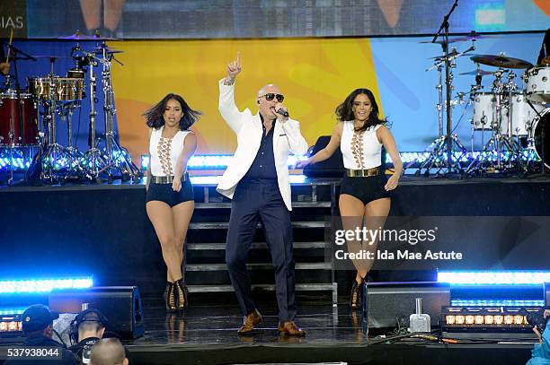Recording artist Pitbull and his dancers perform at the GMA Summer Concert Series from Central Park in New York City, on GOOD MORNING AMERICA,...