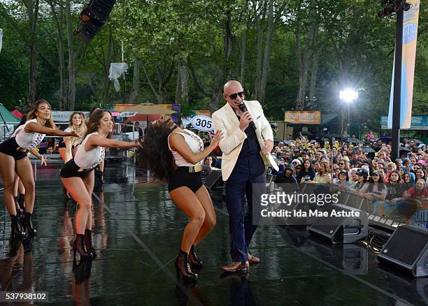 Recording artist Pitbull and his dancers perform at the GMA Summer Concert Series from Central Park in New York City, on GOOD MORNING AMERICA,...