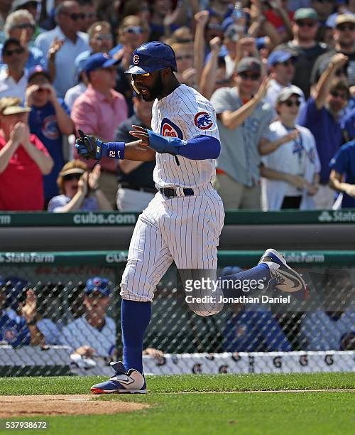 Jason Heyward of the Chicago Cubs celebrates as he scores a run in the 6th inning against the Arizona Diamondbacks at Wrigley Field on June 3, 2016...