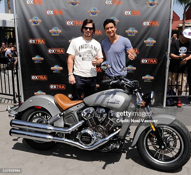 Mark Wahlberg and Mario Lopez visit "Extra" at Universal Studios Hollywood on June 3, 2016 in Universal City, California.