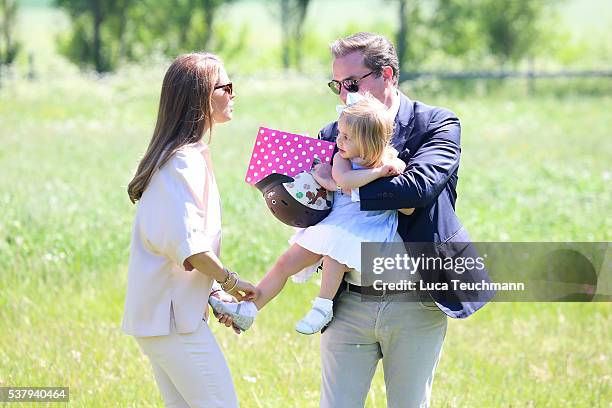 Princess Leonore of Sweden and her mother Princess Madeleine of Sweden and Christopher O'Neil are seen visiting the stables on June 3, 2016 in...