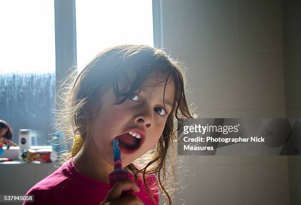 4 year old toddler cleaning her teeth - brushing stock pictures, royalty-free photos & images
