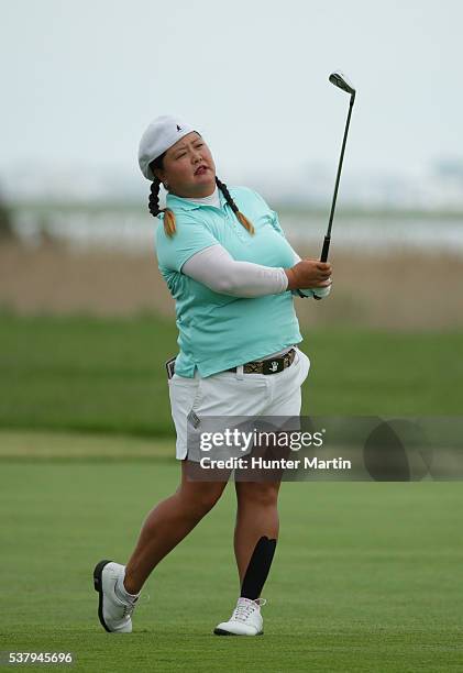 Christina Kim watches her second shot on the third hole during the first round of the ShopRite LPGA Classic presented by Acer on the Bay Course at...