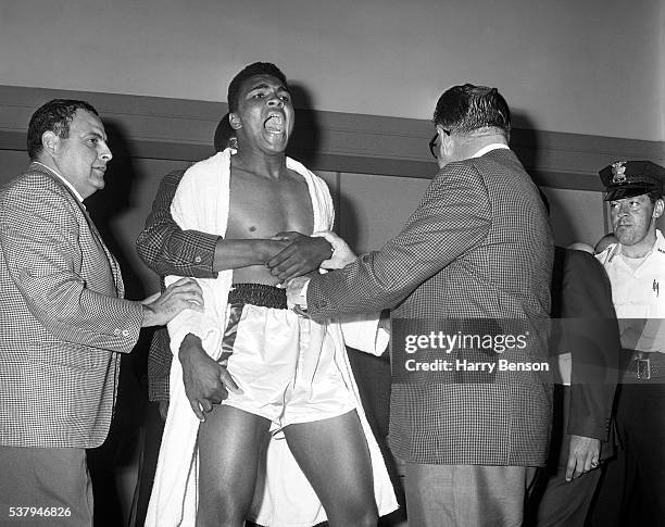 Former heavyweight champion Cassius Clay is photographed during the weigh in for the Clay vs Liston fight in Miami, Florida.