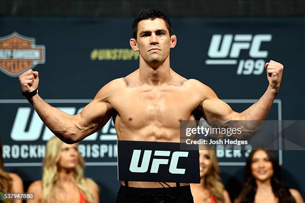 Bantamweight champion Dominick Cruz steps on the scale during the UFC 199 weigh-in at the Forum on June 3, 2016 in Inglewood, California.