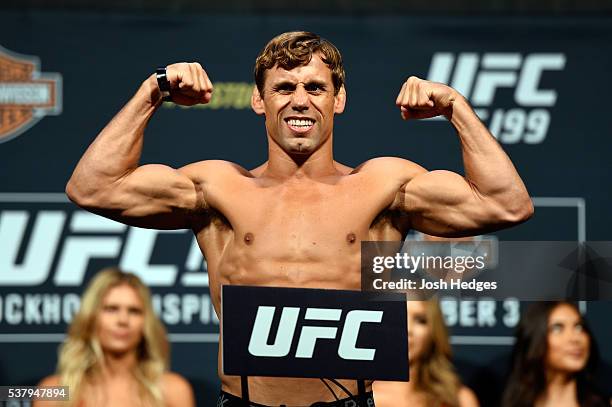 Bantamweight title challenger Urijah Faber steps on the scale during the UFC 199 weigh-in at the Forum on June 3, 2016 in Inglewood, California.