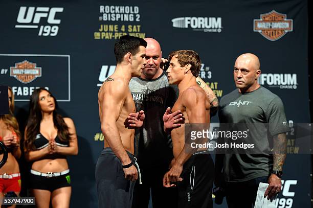 Opponents Dominick Cruz and Urijah Faber face off during the UFC 199 weigh-in at the Forum on June 3, 2016 in Inglewood, California.