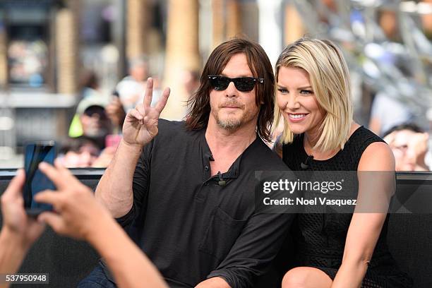 Norman Reedus and Charissa Thompson visit "Extra" at Universal Studios Hollywood on June 3, 2016 in Universal City, California.