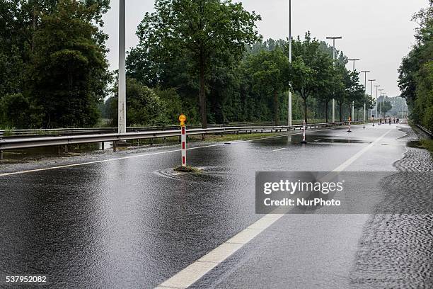 Illustration picture shows the N80 being closed down from traffic because of floods in Alken, Limburg, Belgium on June 3, 2016.