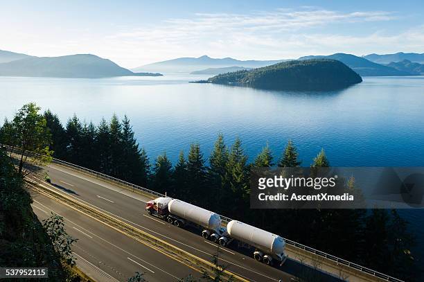transport truck driving along highway 99, bc, canada - crude oil stock pictures, royalty-free photos & images