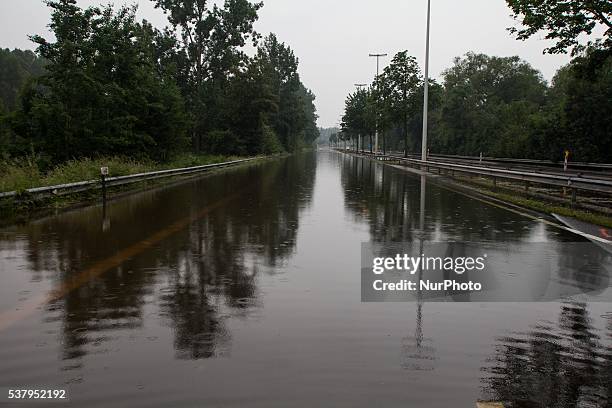 Illustration picture shows the N80 being closed down from traffic because of floods in Alken, Limburg, Belgium on June 3, 2016.