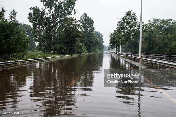 Illustration picture shows the N80 being closed down from traffic because of floods in Alken, Limburg, Belgium on June 3, 2016.