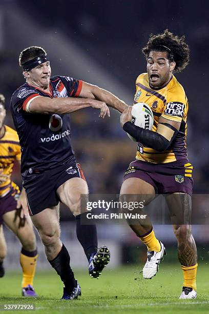 Adam Blair of the Broncos is tackled by Jacob Lillyman of the Warriors during the round 13 NRL match between the New Zealand Warriors and the...