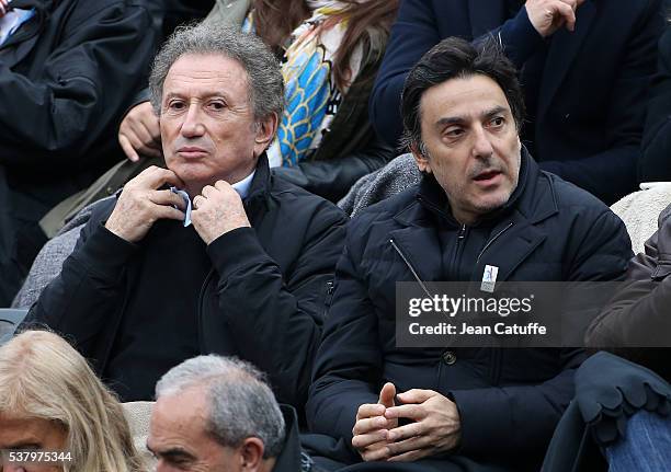 Michel Drucker and Yvan Attal attend day 13 of the 2016 French Open held at Roland-Garros stadium on June 3, 2016 in Paris, France.