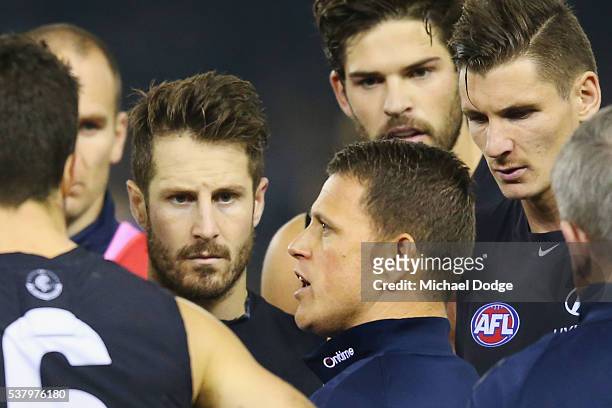 Blues head coach Brendon Bolton speaks to his players during the round 11 AFL match between the Carlton Blues and the Brisbane Lions at Etihad...